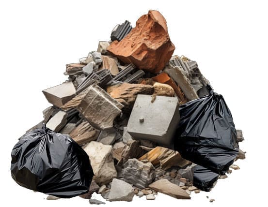 A pile of mixed construction waste including garbage bags, drywall, insulation and wood