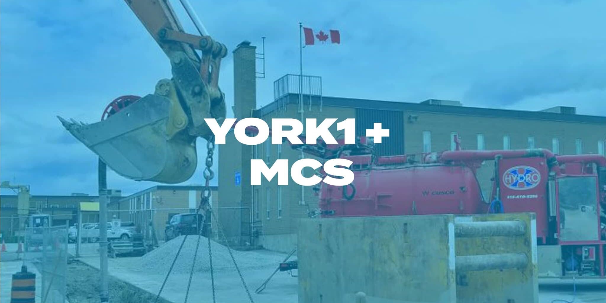 Hydrovac truck and excavator on a job site. Photo with blue overlay, YORK1 + MCS in white text.